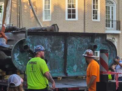 Workers Inspect Base of Stonewall Jackson Statue